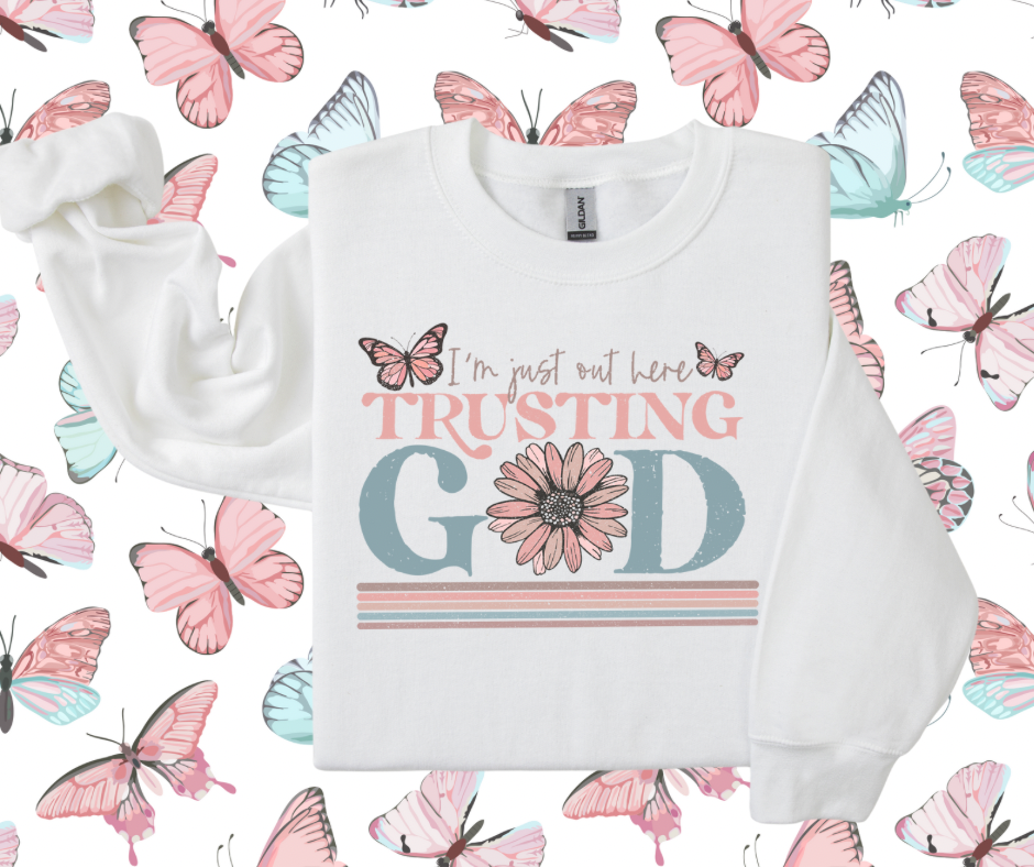 I’m just out here trusting God crewnecks