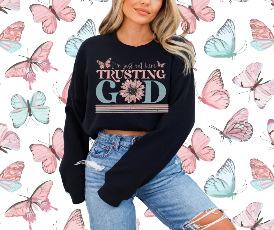 I’m just out here trusting God crewnecks