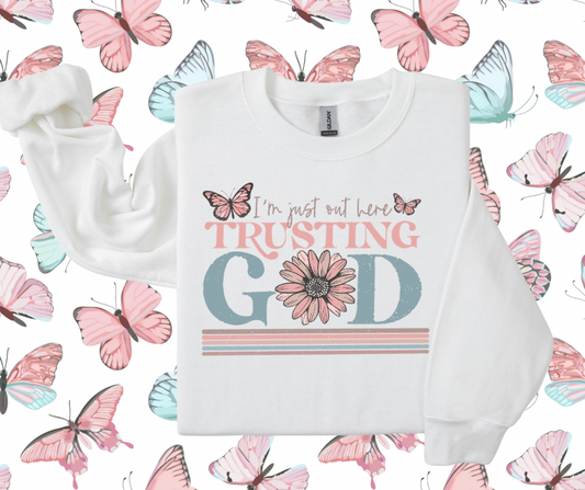 I’m just out here trusting God crewnecks